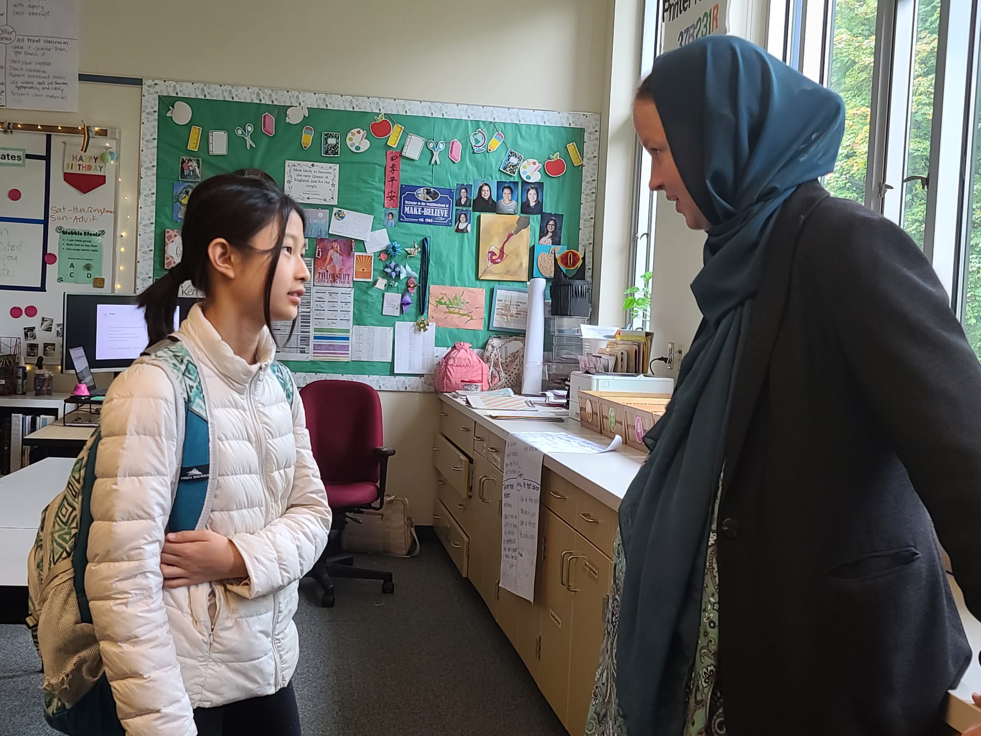 Melissa listening to a student