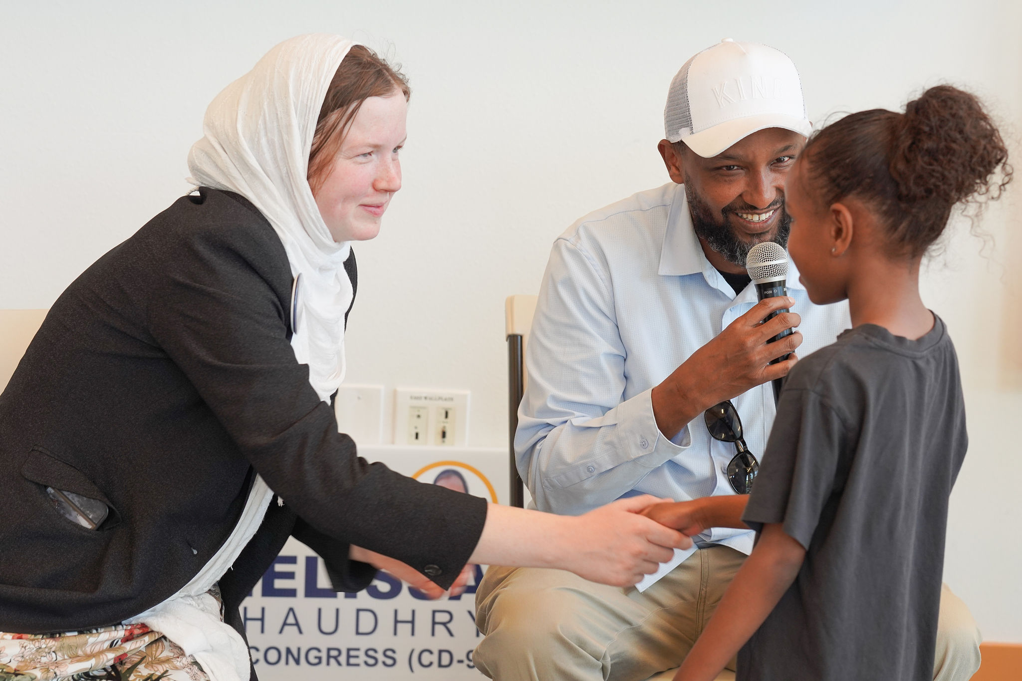 Melissa connecting with a child at a campaign community event