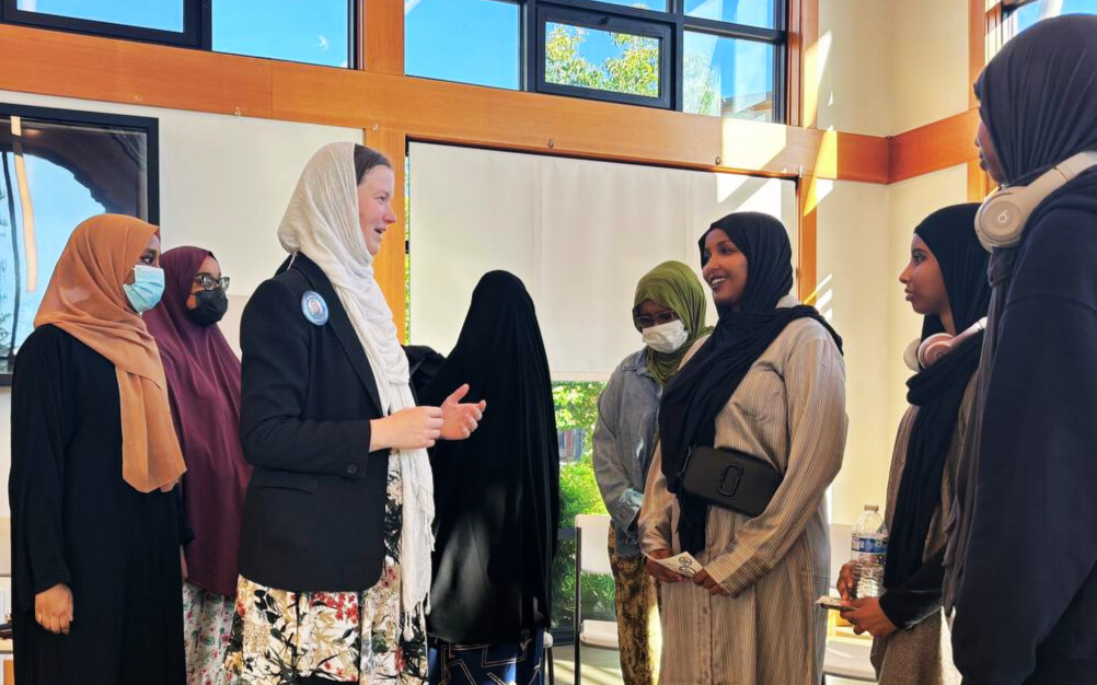 Melissa speaking with Muslim students at a community event
