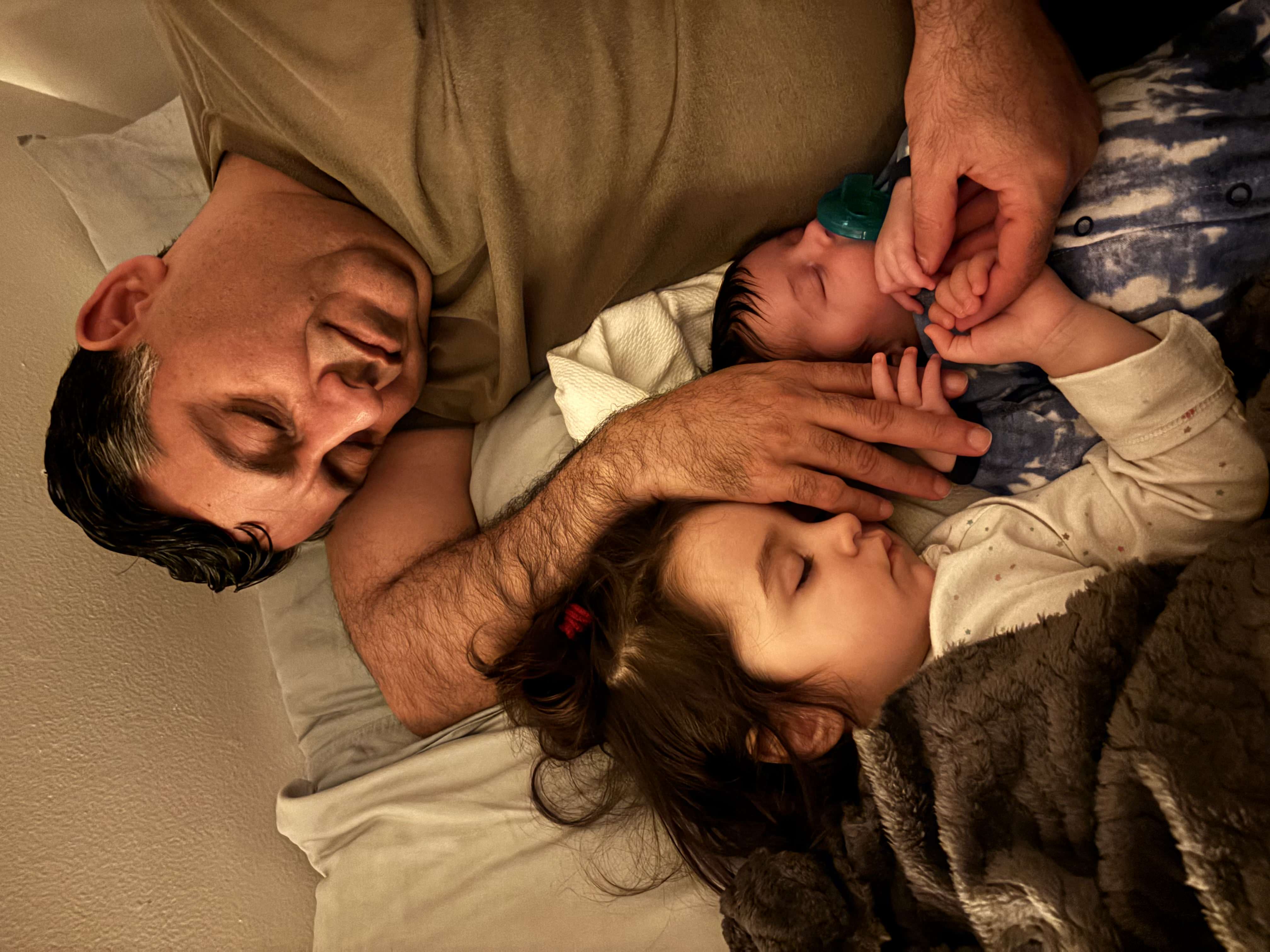 Zahid sleeping with Salma and newborn Adil — the family he almost lost